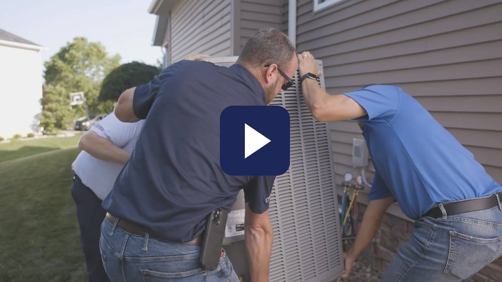 HVAC Technicians installing a unit.